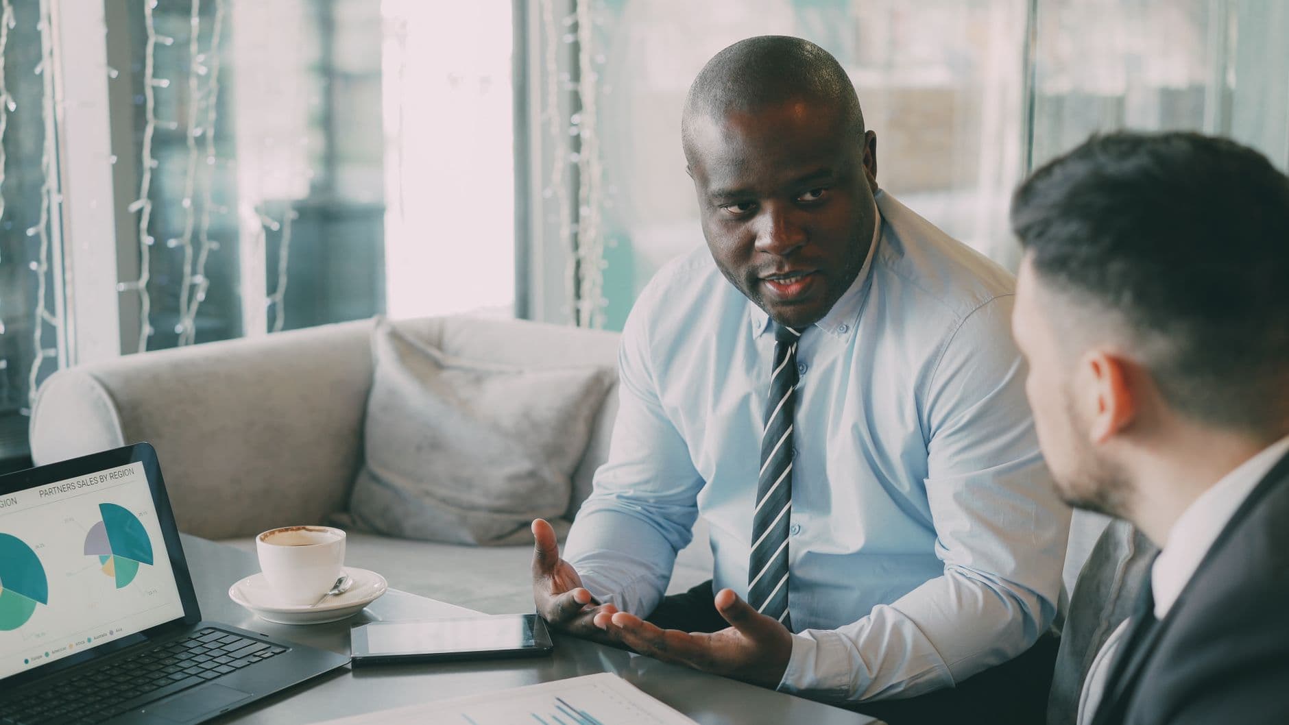 CPA and small business owner reviewing financial plans at a desk