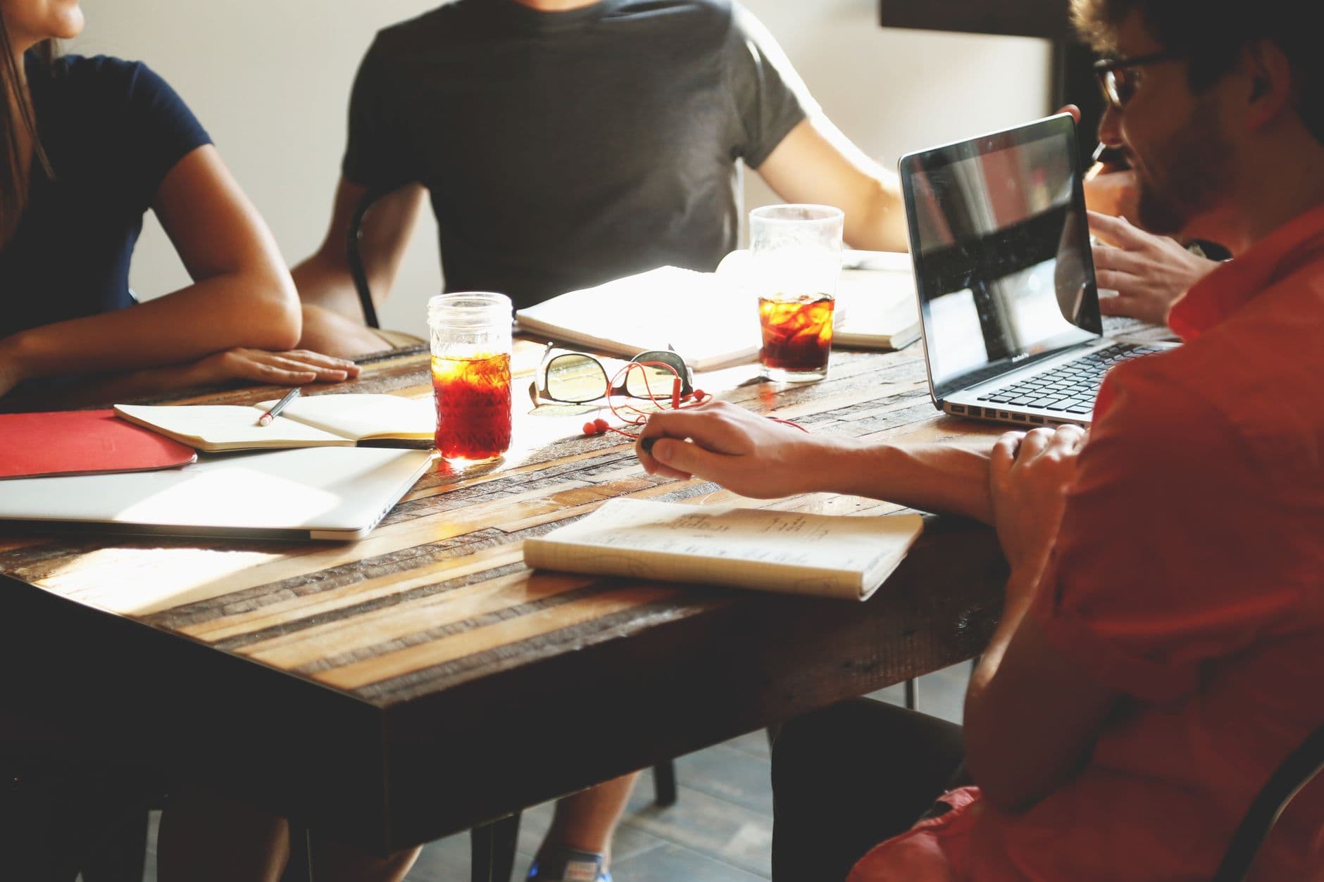 CPA reviewing financial strategy with small business owner at desk