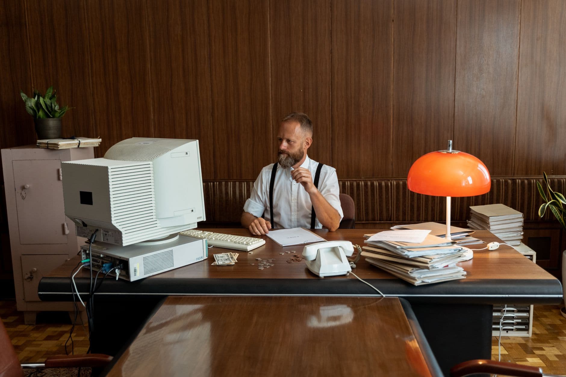 Accountant and farm business owner reviewing financial documents together in an office