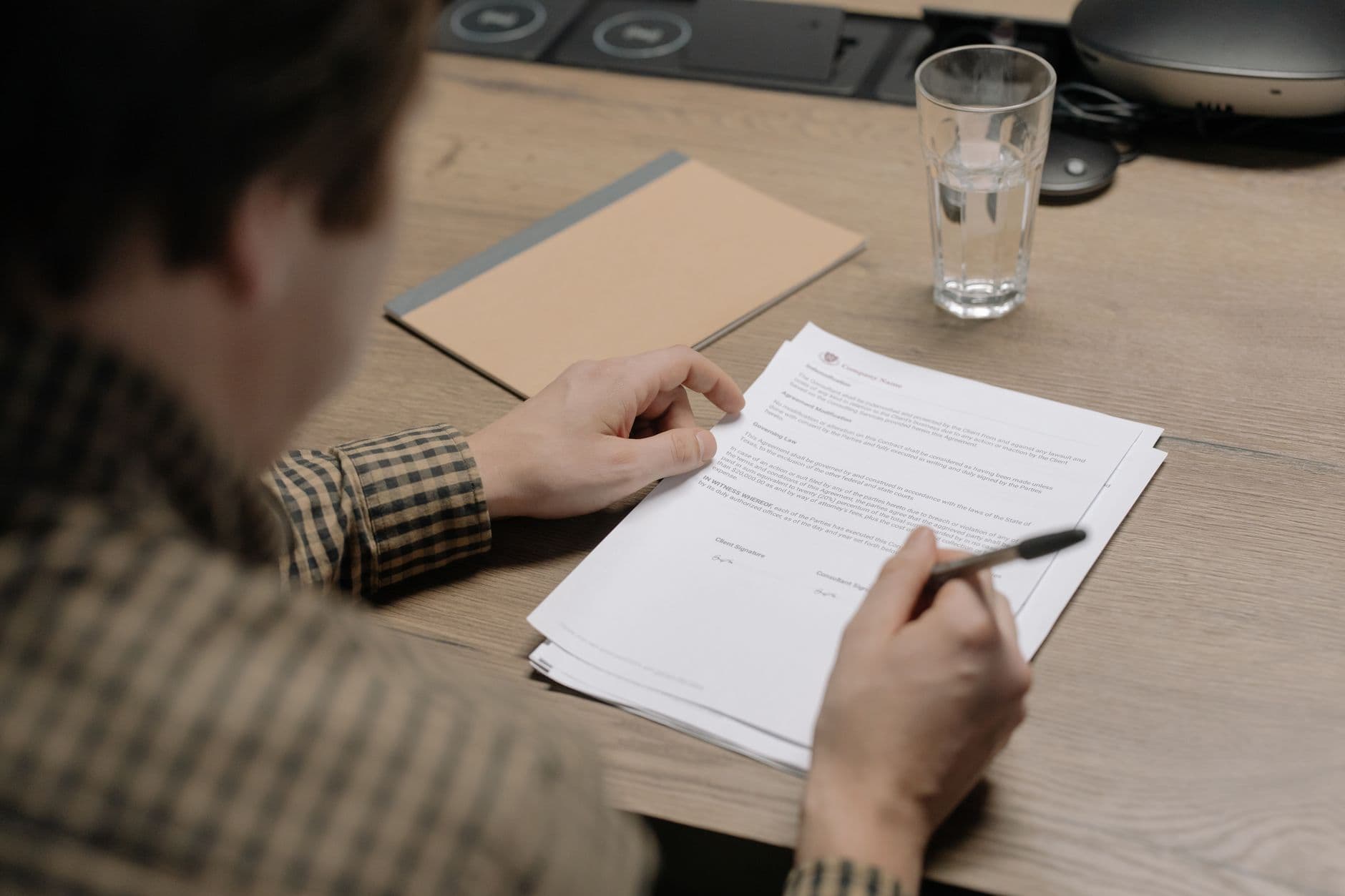 Farmer reviewing financial documents at a desk to evaluate insurance coverage needs