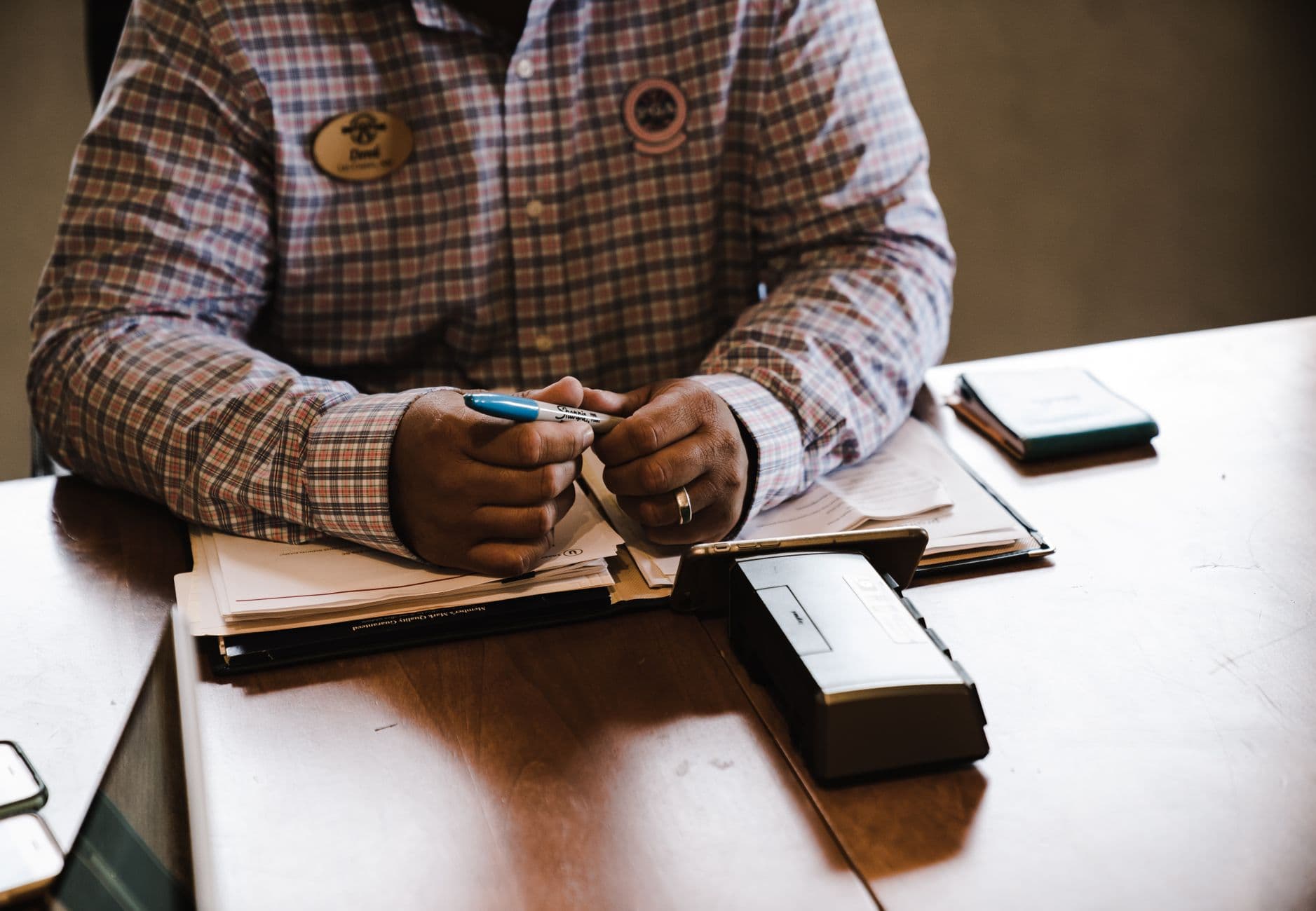Small business owner reviewing financial statements and cash flow numbers at a desk