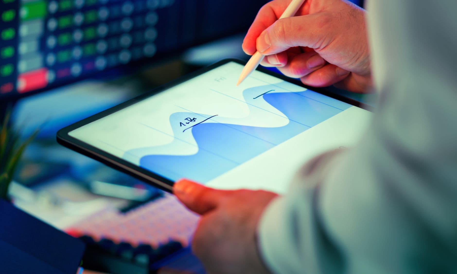 Business owner viewing financial dashboard reports on a screen