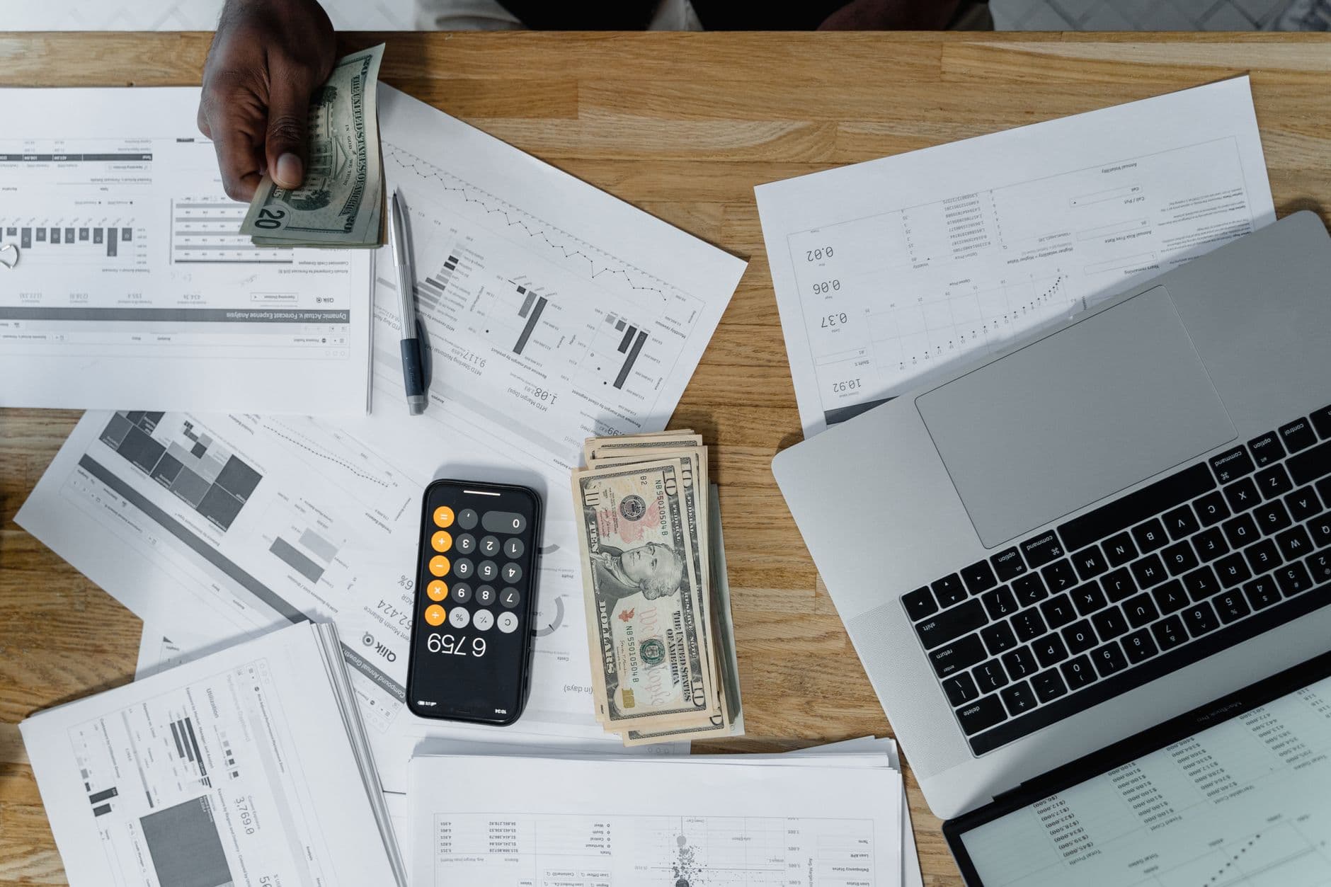 Business owner viewing a payroll dashboard on a laptop screen