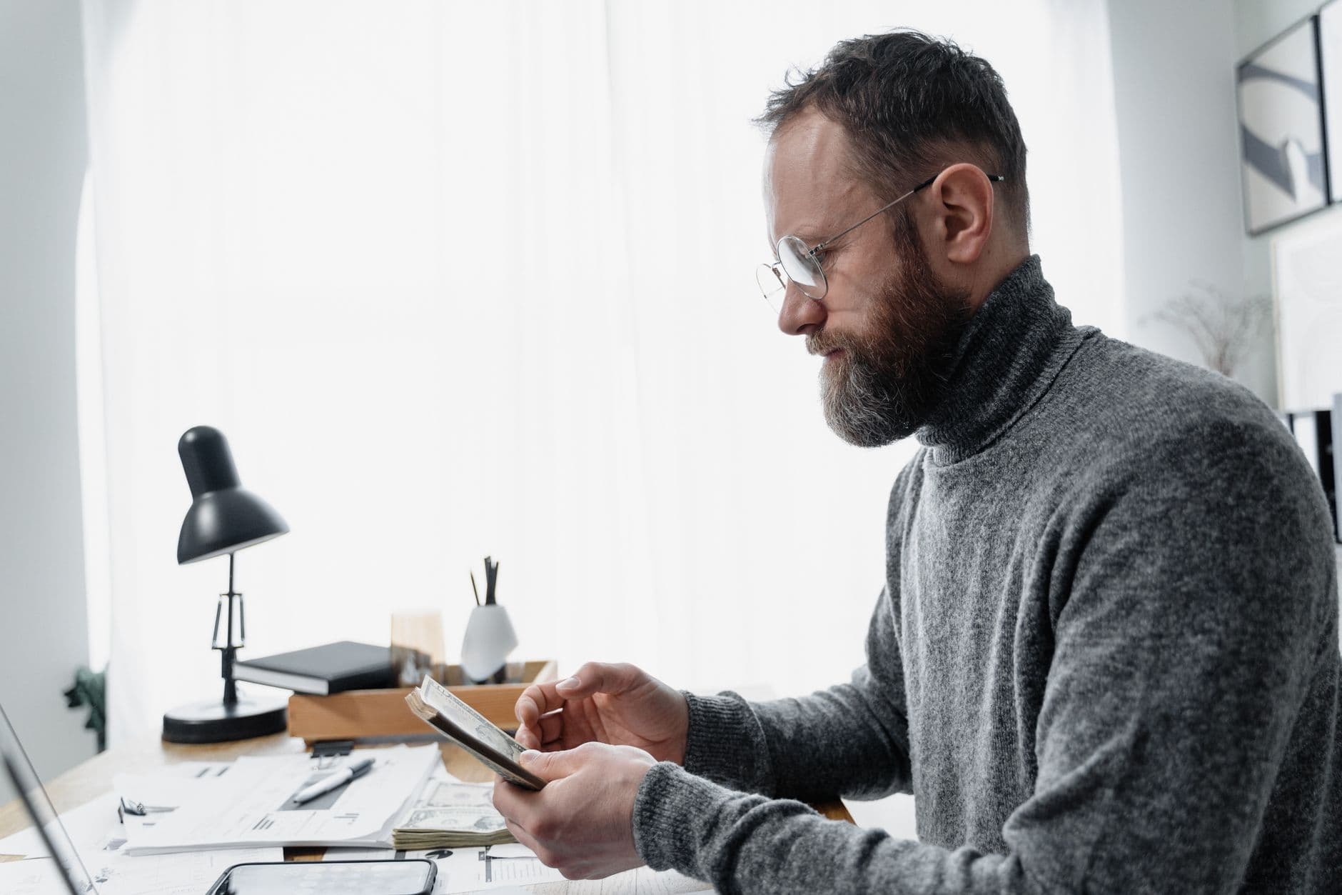 Accountant processing payroll on a computer for a small business client