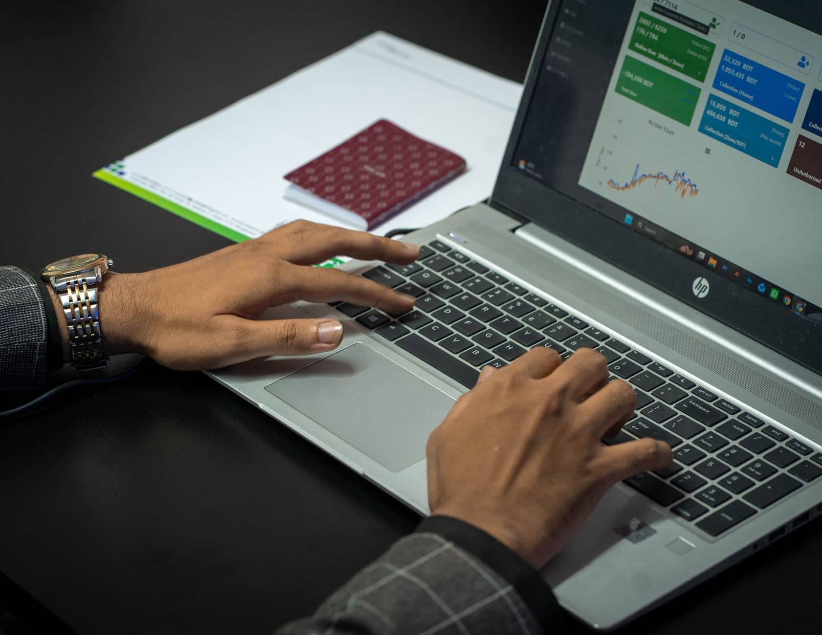 Service business owner checking financial dashboard on a laptop