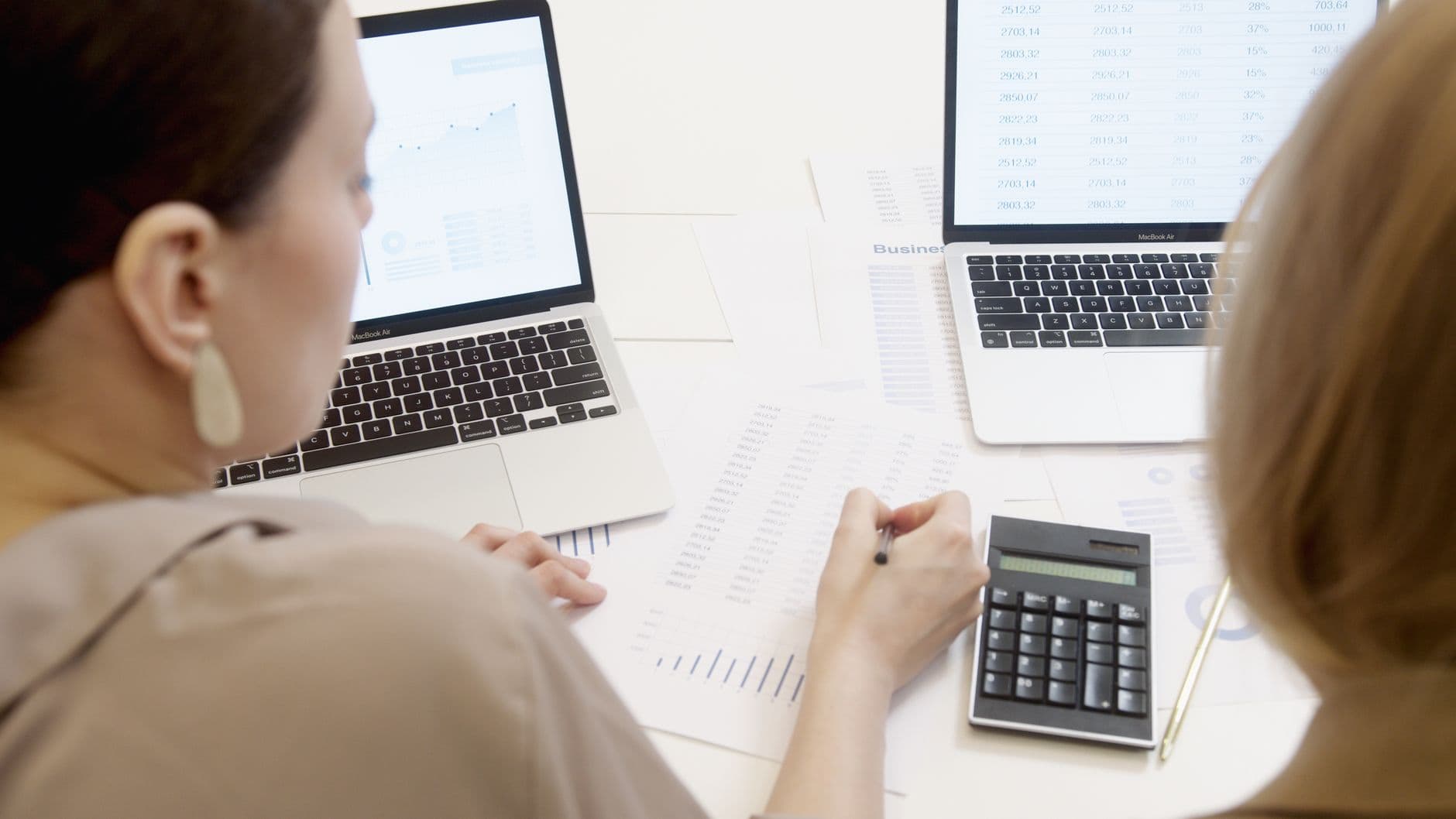 CPA and business owner reviewing R&D tax credit calculations on a laptop