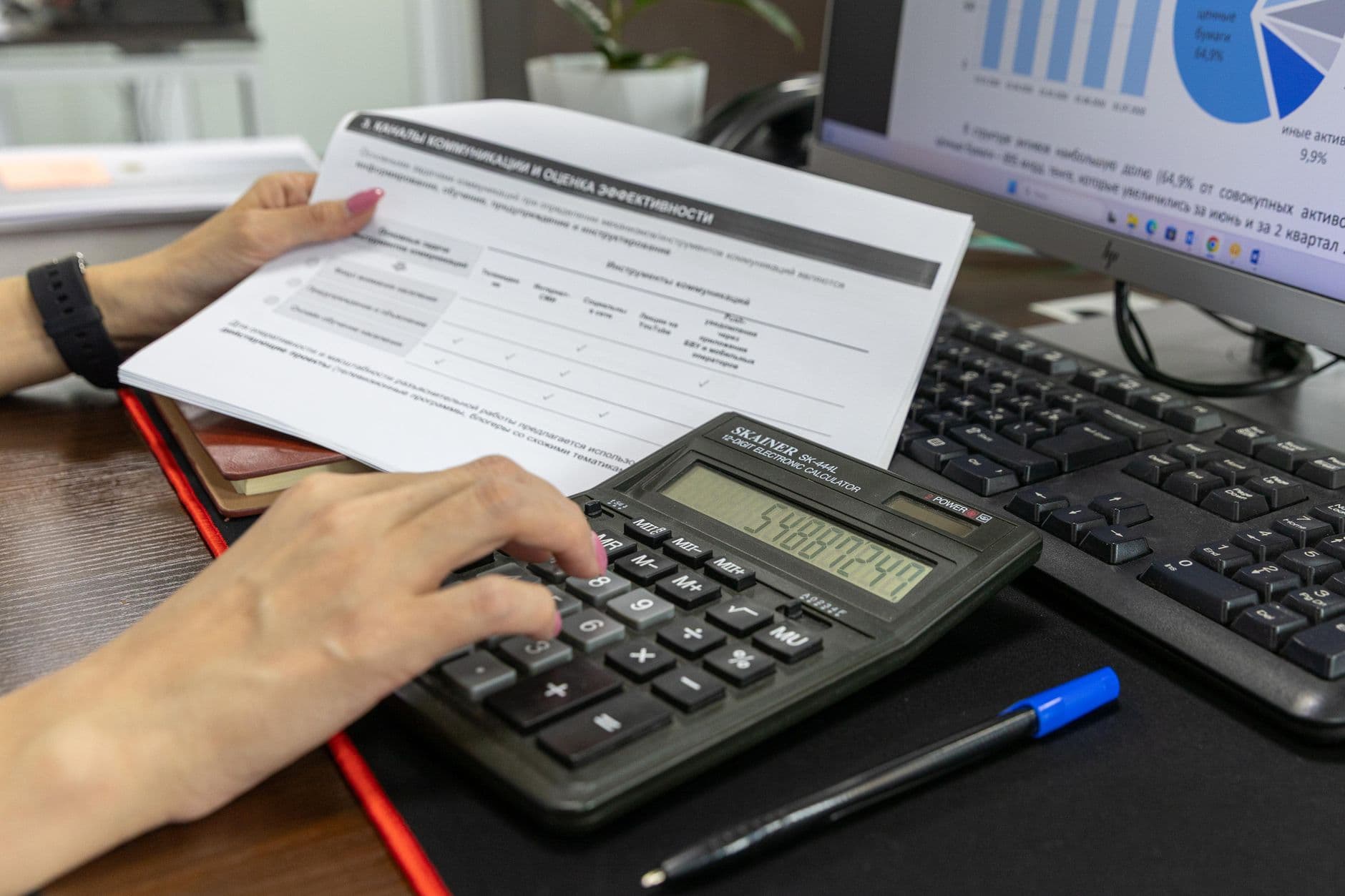 CPA and farm business owner reviewing R&D tax credit paperwork at a desk
