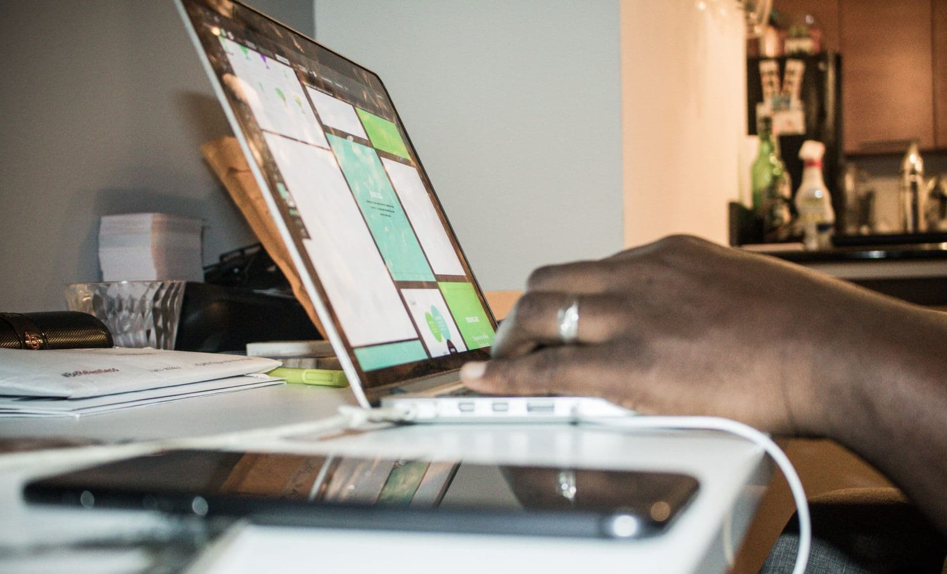 Business owner uploading tax documents through a secure online portal on a laptop