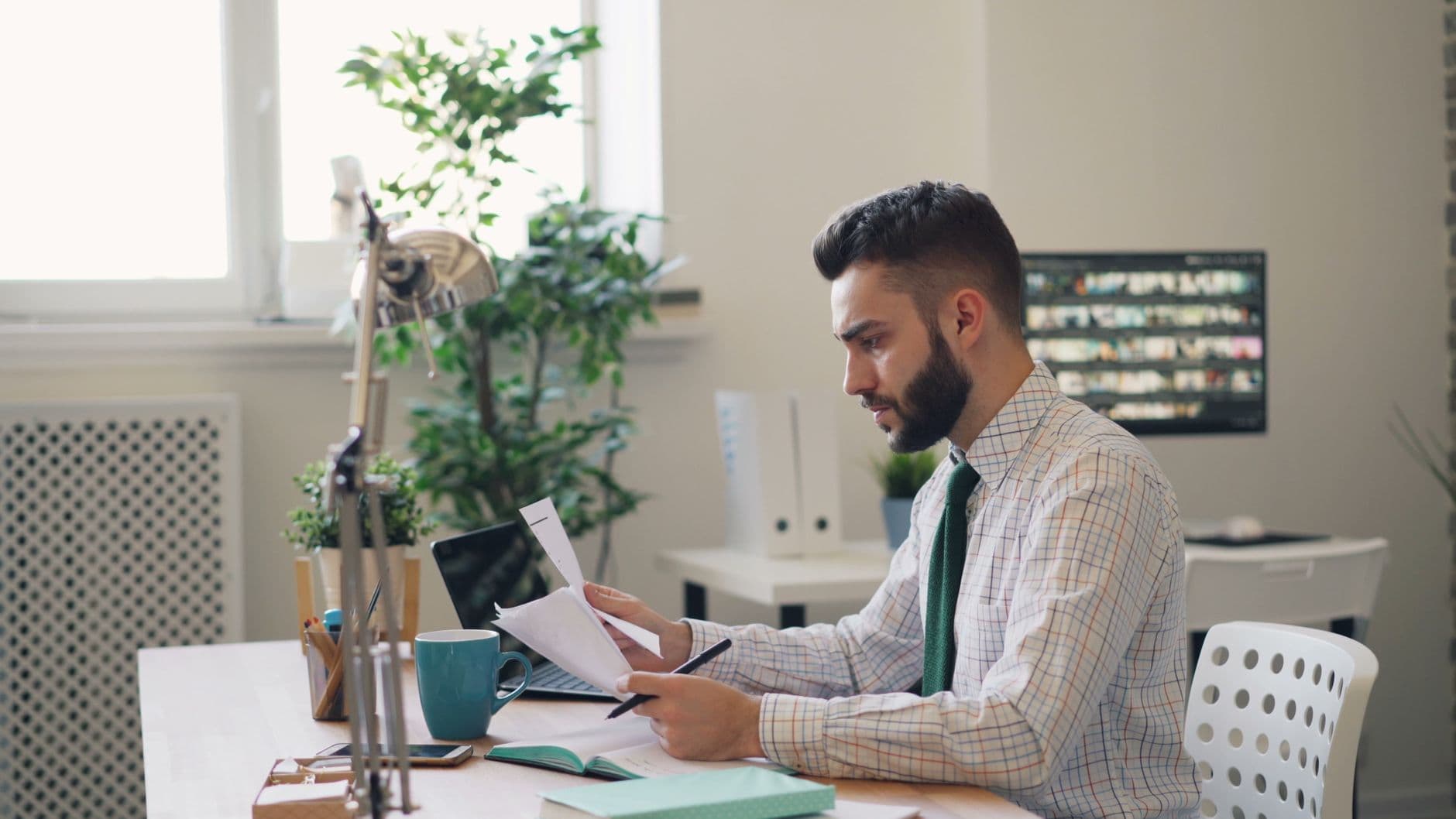 Farmer and accountant reviewing tax documents at a table