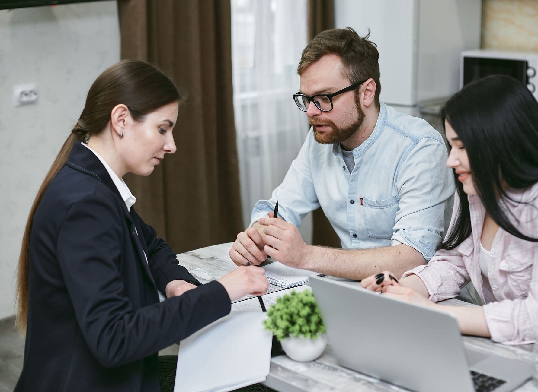 CPA and farm client reviewing tax planning documents together